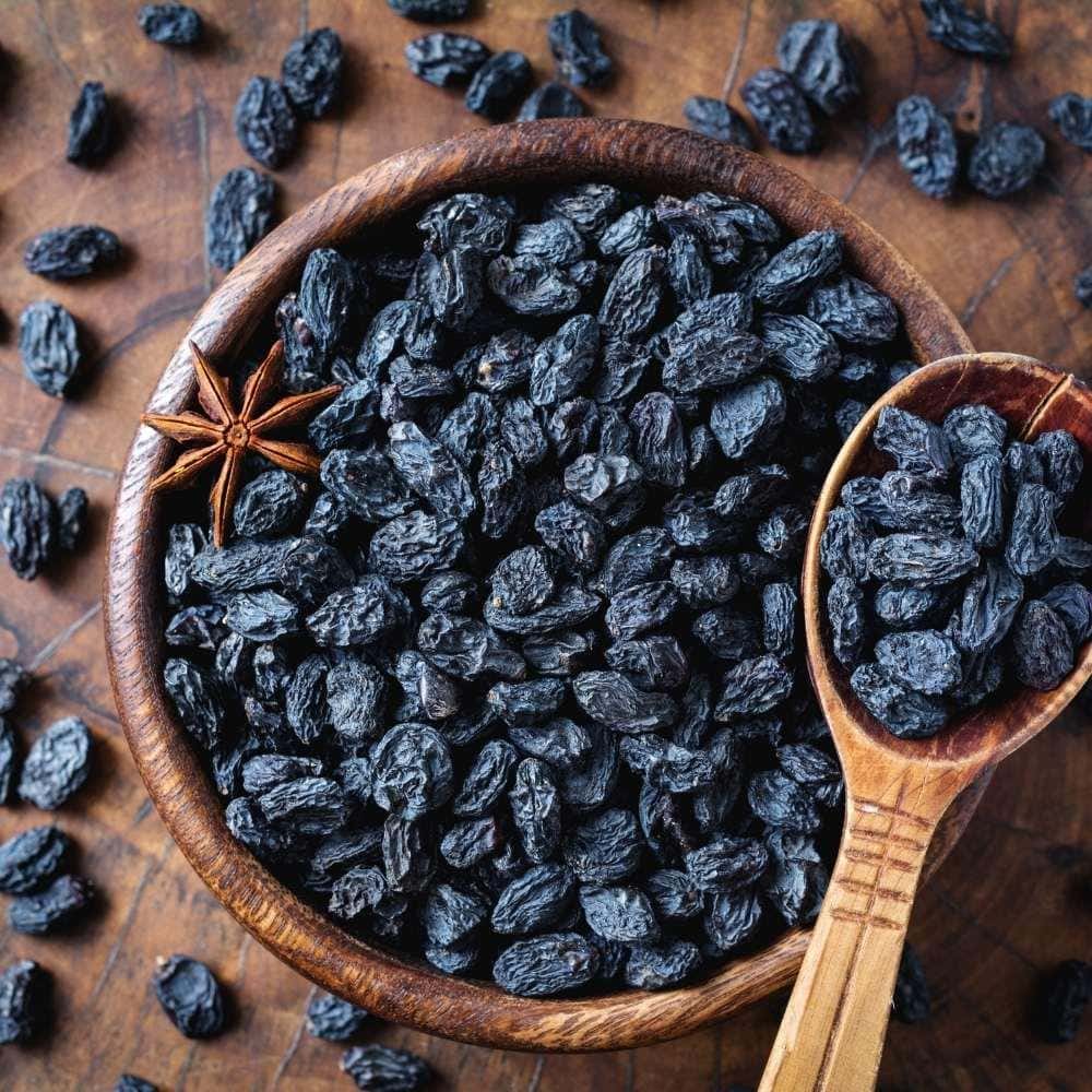 Indulge in the rich flavor of premium Black Raisins or Kali Drakh from Sindhi Dry Fruits.